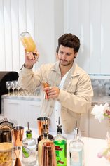 Two people mid-shake at a cocktail class