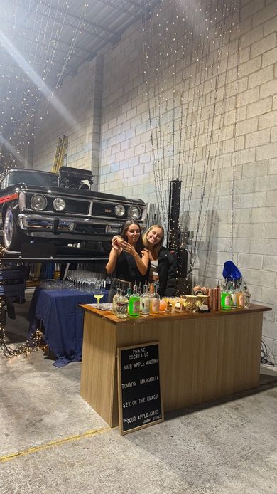 The Jimmy Slings crew running a venue bar at night